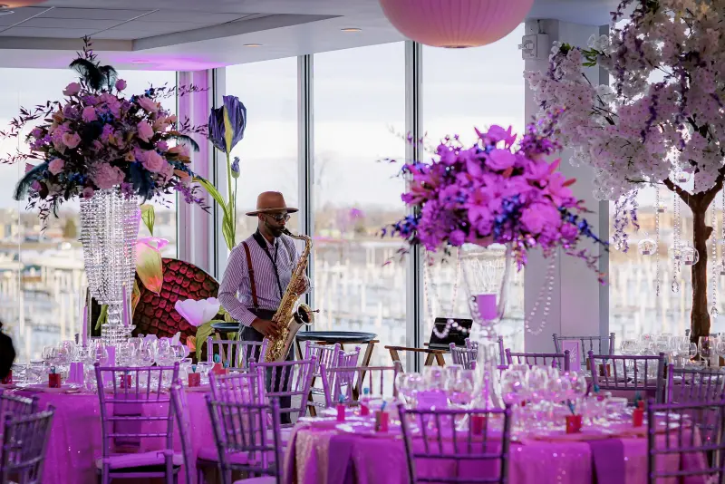 Live saxophonist among florals at The Roostertail